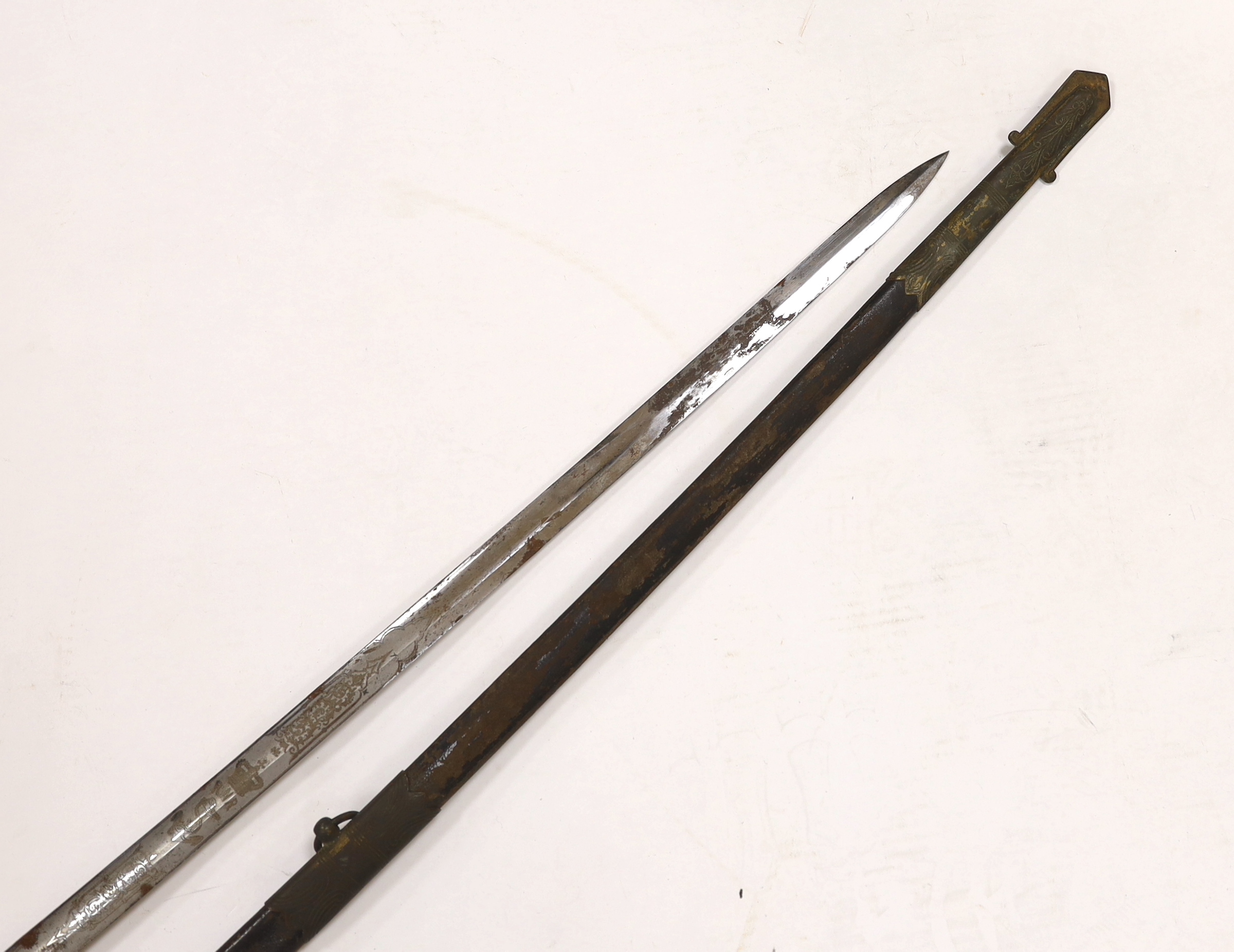 A late Victorian naval officer’s sword of the Royal Naval Reserve, regulation hilt with folding guard and bullion dress knot, in its leather scabbard with brass mounts